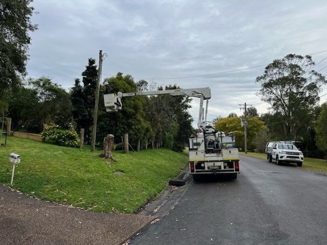 Utility Truck with Raised Boom Parked on A Suburban Street — SRB Electrical Contracting Pty Ltd In Davistown, NSW