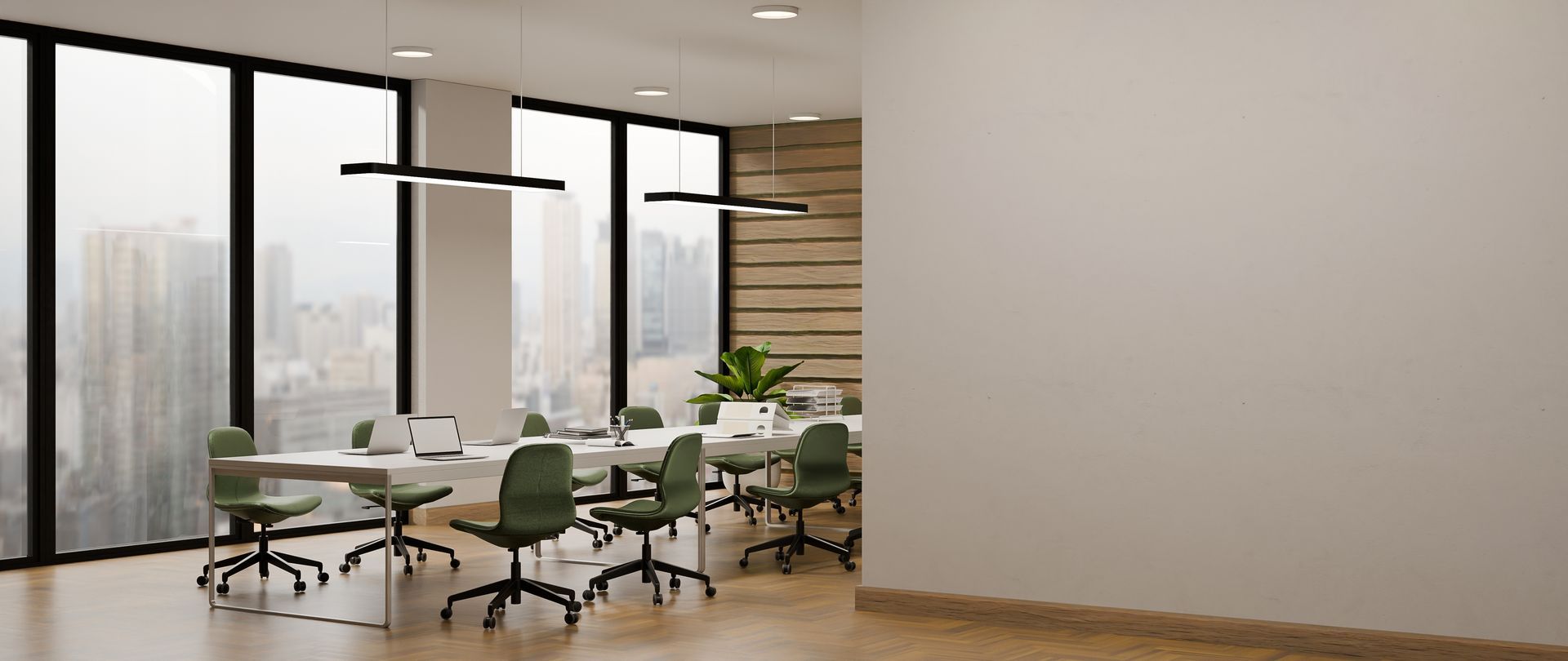 Modern office conference room with glass walls, green chairs, and a long table by large windows.