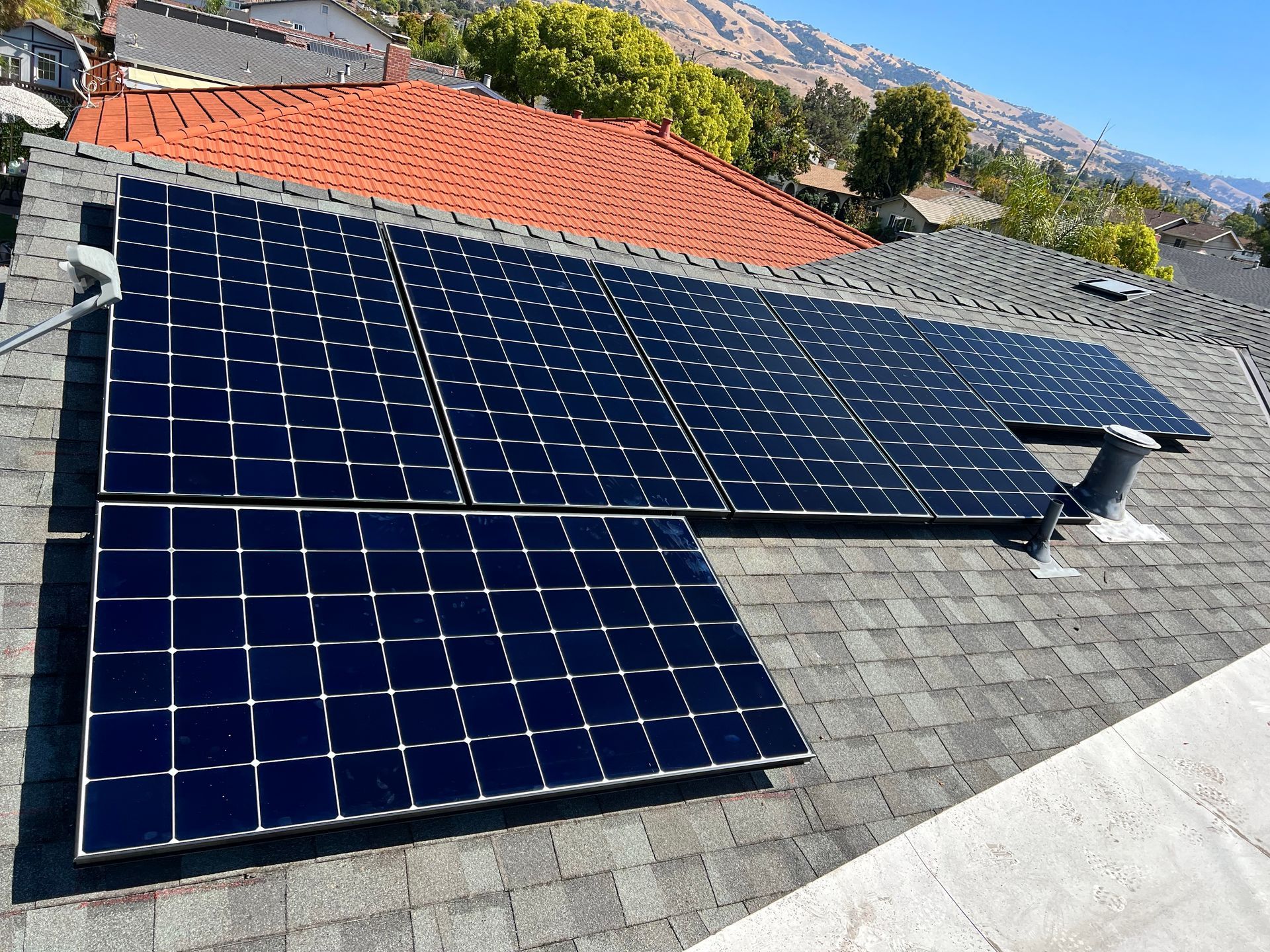 A roof with a lot of solar panels on it