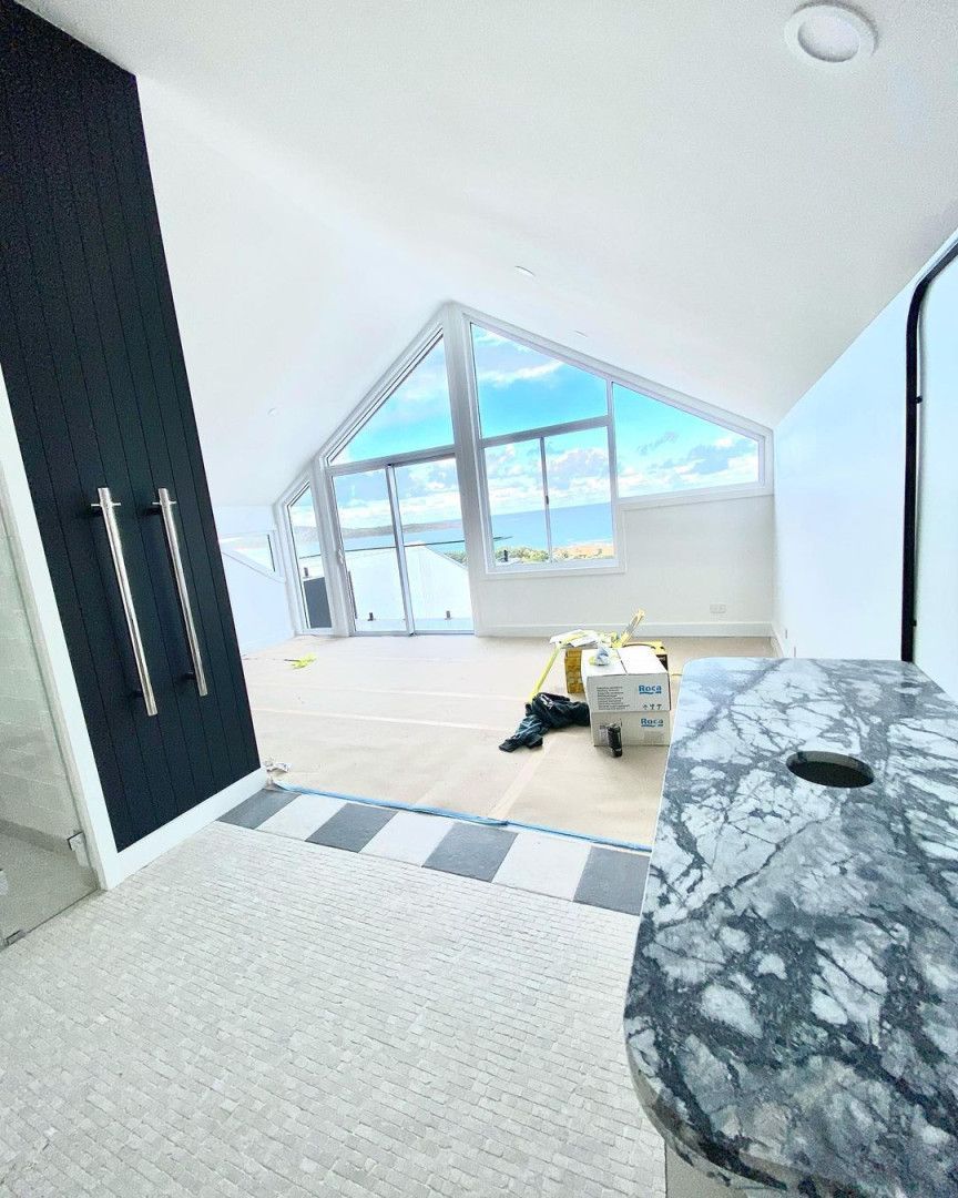 A Bathroom With A Large Window And A Marble Counter Top — MC Plastering In Newcastle, NSW