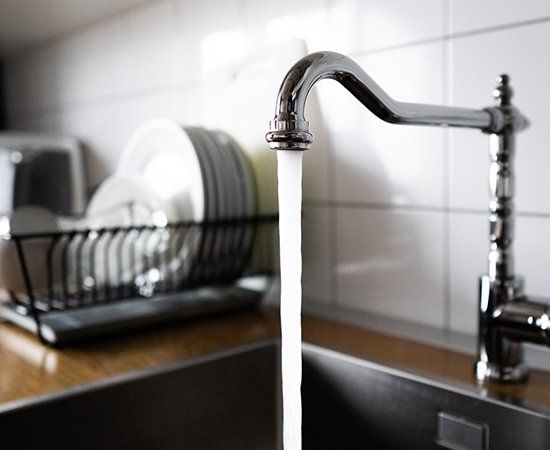 Water Flowing In Kitchen — Yorktown, VA — Dave's Plumbing Inc.