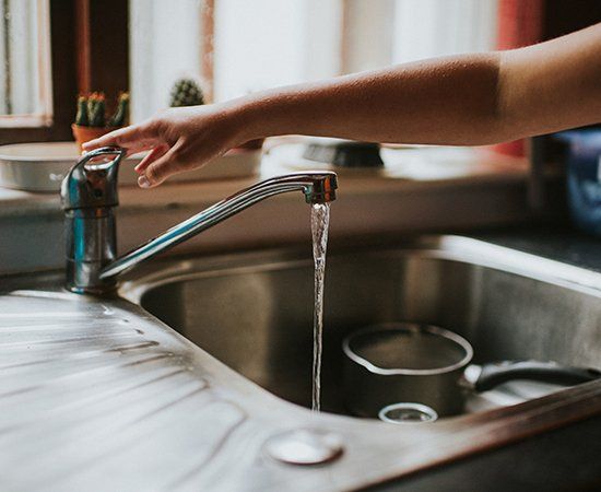 Hand Turning Off A Running Water — Yorktown, VA — Dave's Plumbing Inc. Hand Turning Off A Running Water — Yorktown, VA — Dave's Plumbing Inc.
