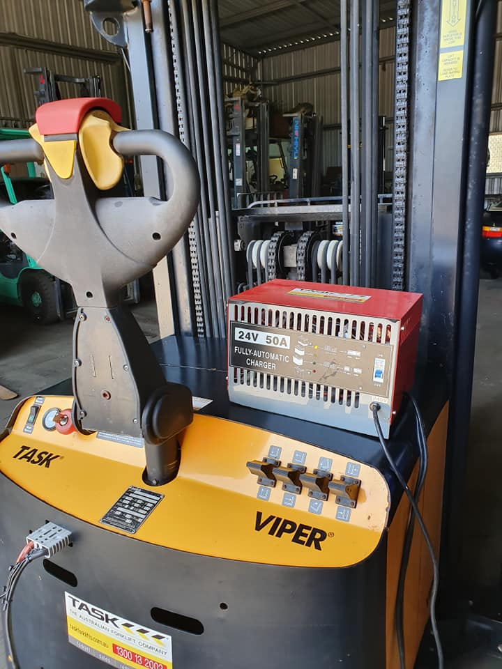 Yellow and Black Viper Pallet Jack With Control Handle in a Warehouse — Forklift Repairs & Spares In Svensson Heights, QLD