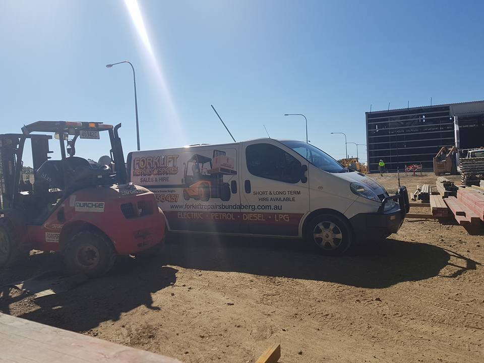 Red Forklift Beside A White Work Van — Forklift Repairs & Spares In Hervey Bay, QLD