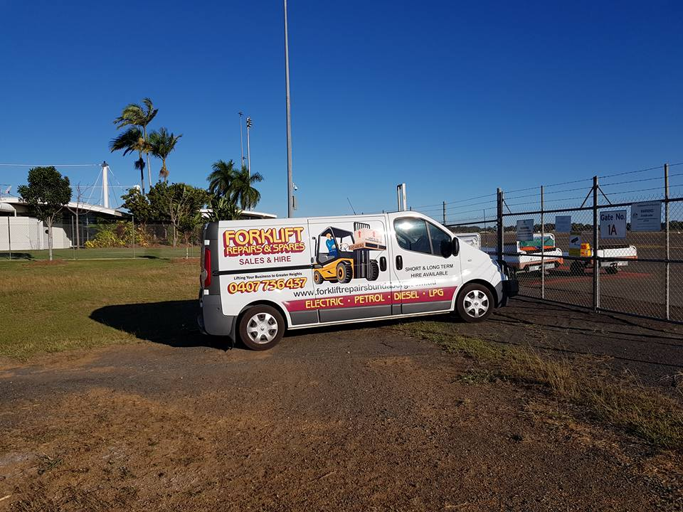 White Advertising Van Parked on a Grassy Lot — Forklift Repairs & Spares In Svensson Heights, QLD
