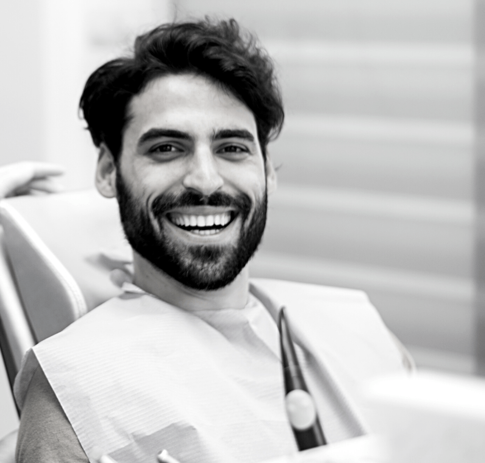 Man relieved after wisdom teeth removal | Visit the best dentist in Leawood 66209 for wisdom teeth extractions. Dental extractions