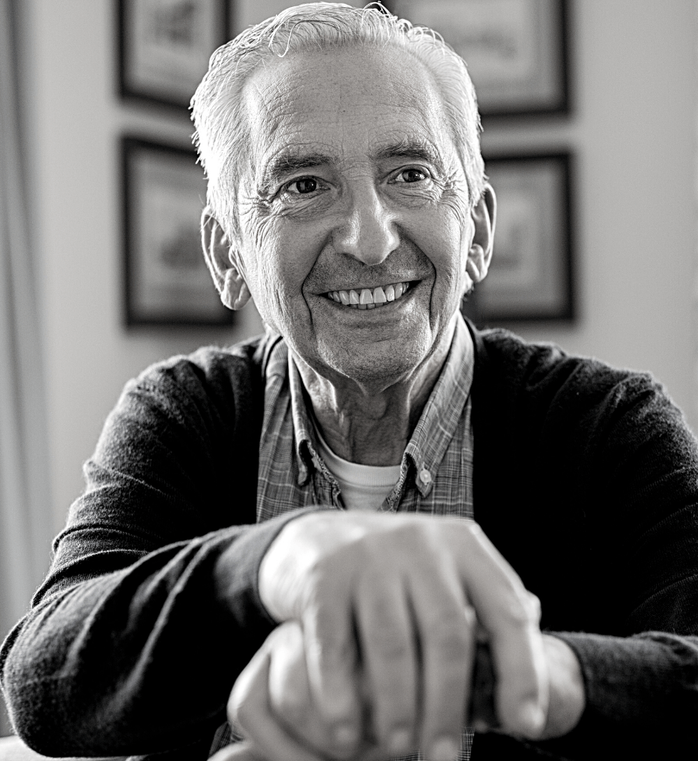 Man smiling with full teeth | Get custom dentures in Leawood 66209. Partial dentures
