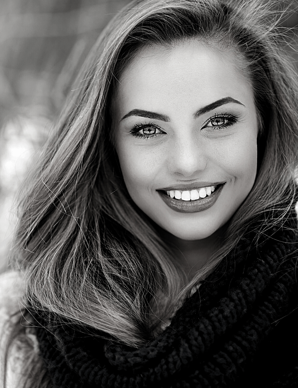 Woman smiling with flawless teeth | Get veneers in Leawood 66209. Porcelain veneers