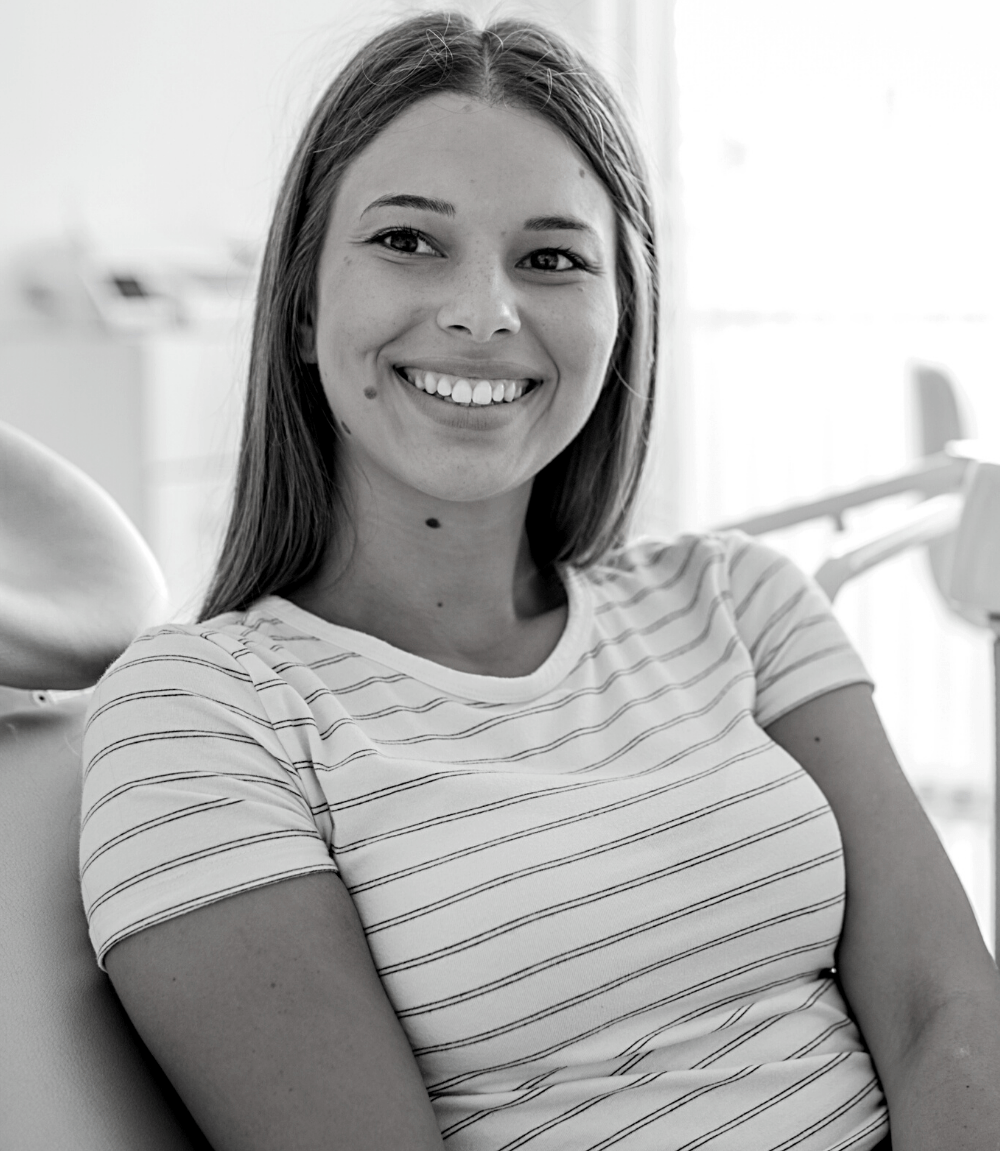 Woman with restored teeth | Visit the best dentist in Leawood 66209 for dental crowns. dental crown and Bridges