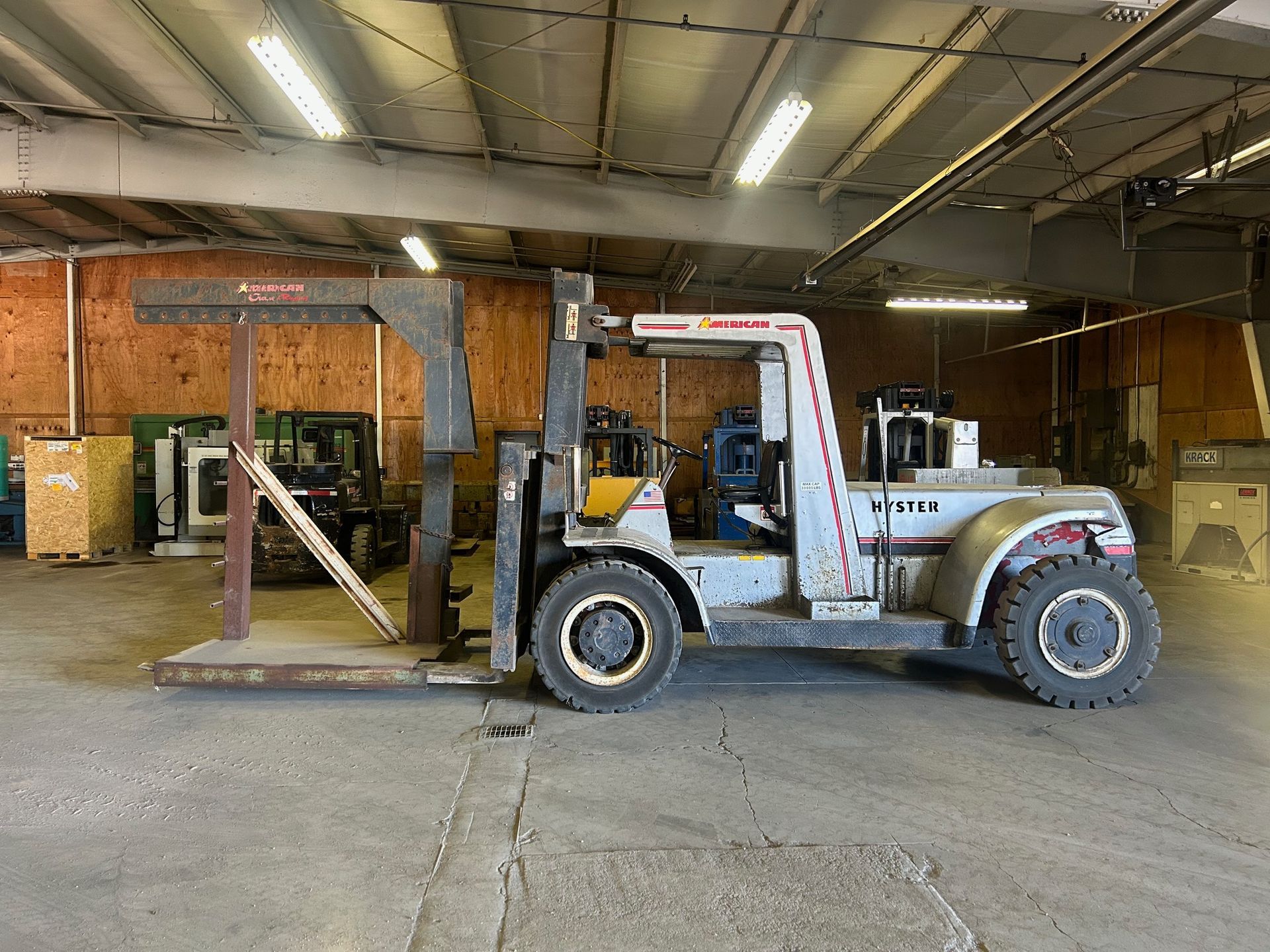 Forklift in an empty warehouse.