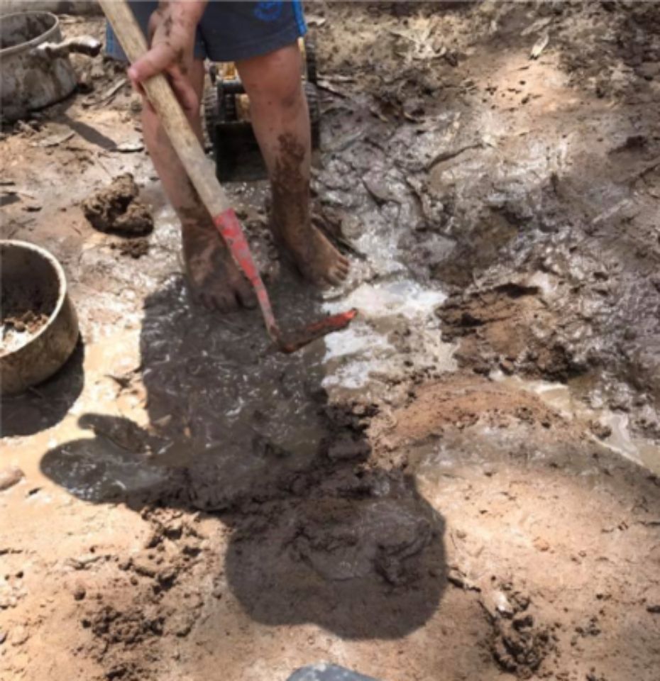 man digging soil