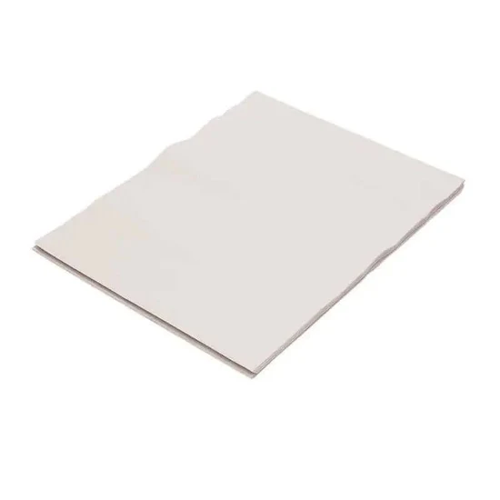 White folded sheet of paper on a plain white background