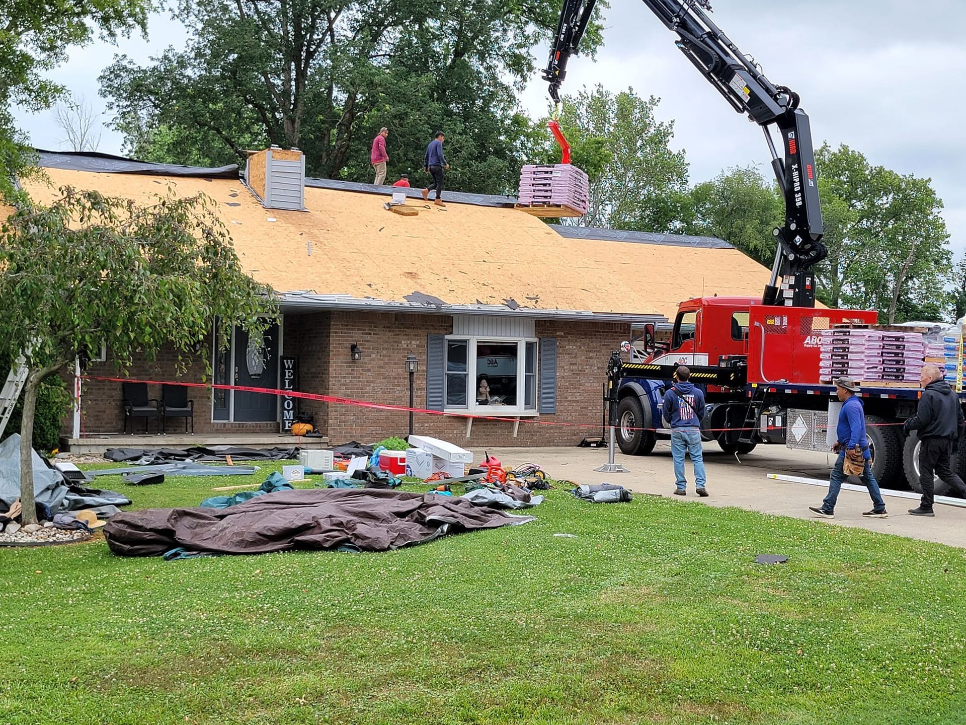 Roofing Crew and Crane