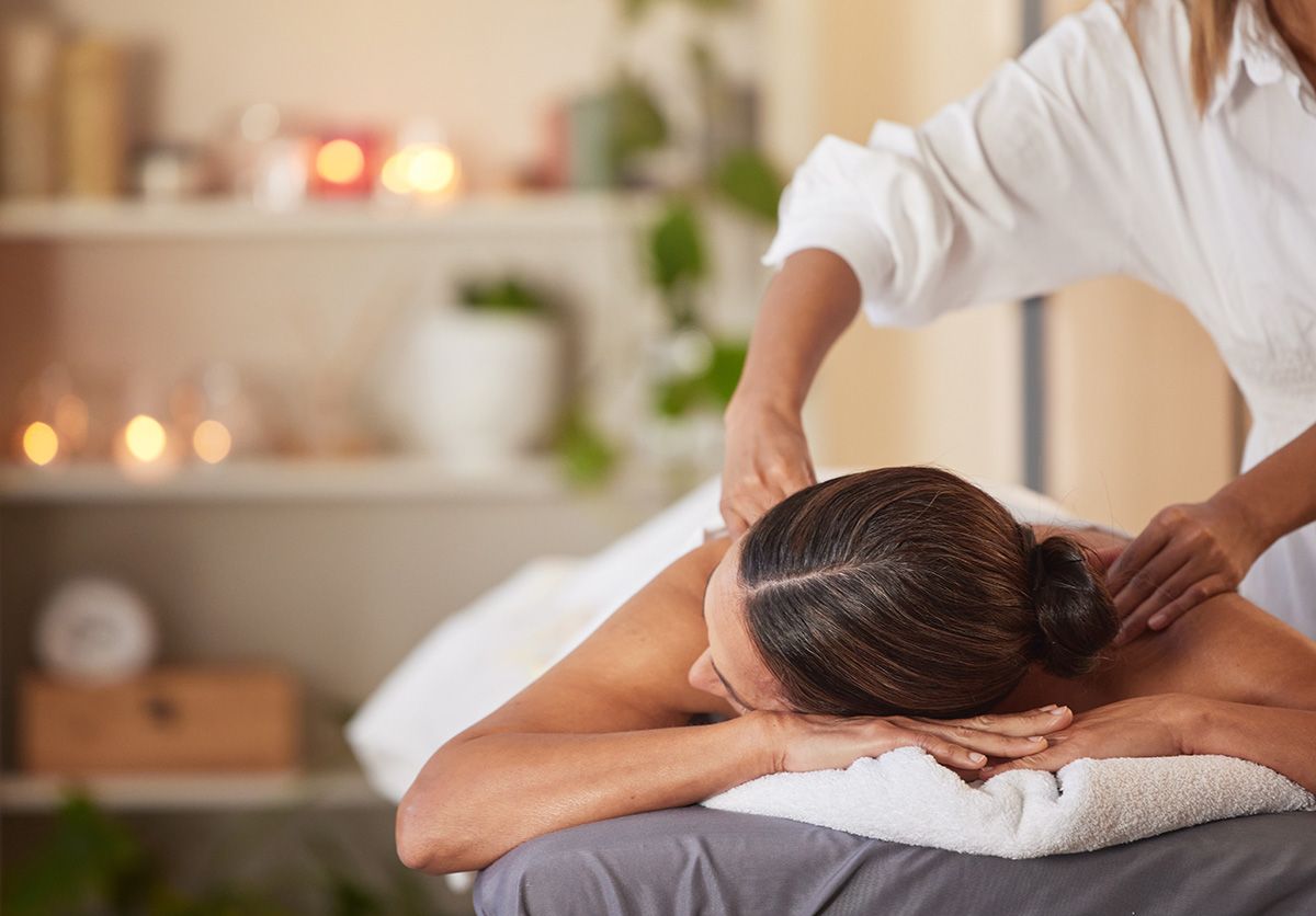 a woman is getting a massage at a spa