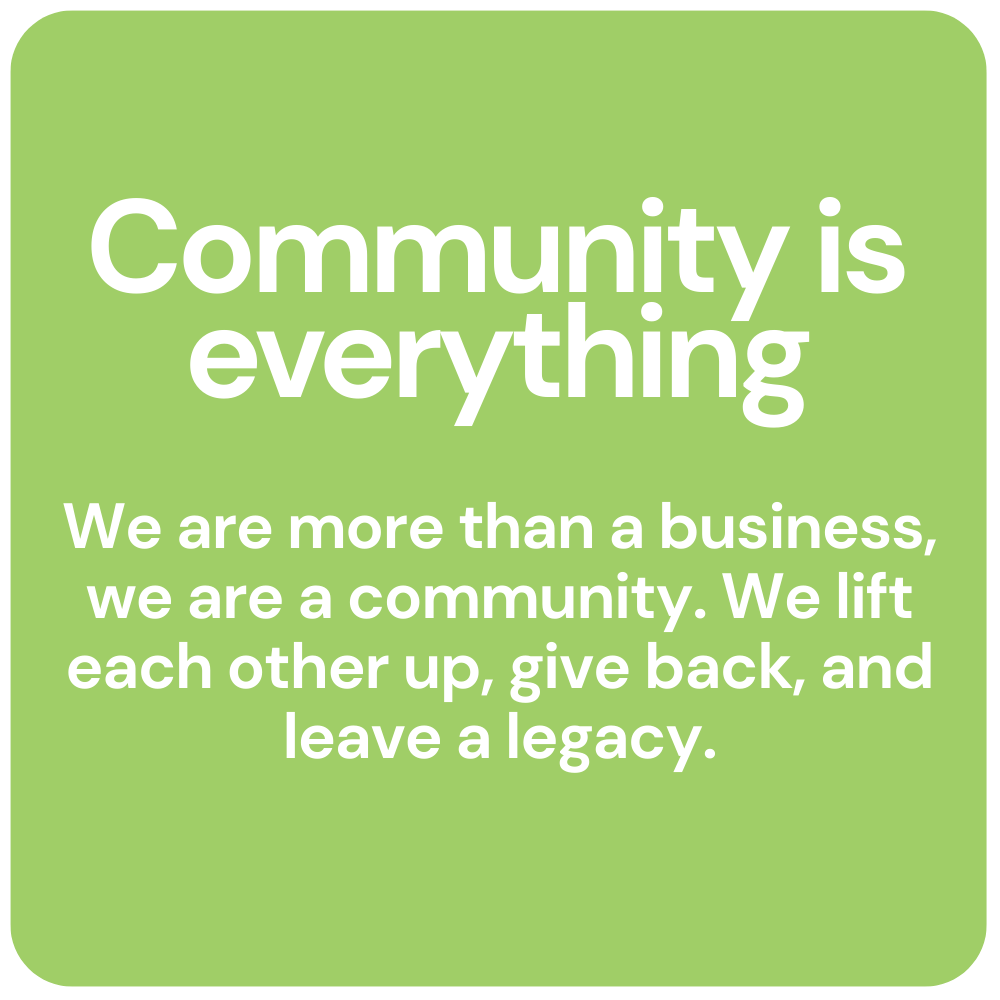 Green poster reading “Community is everything” with a message about lifting each other up and giving back