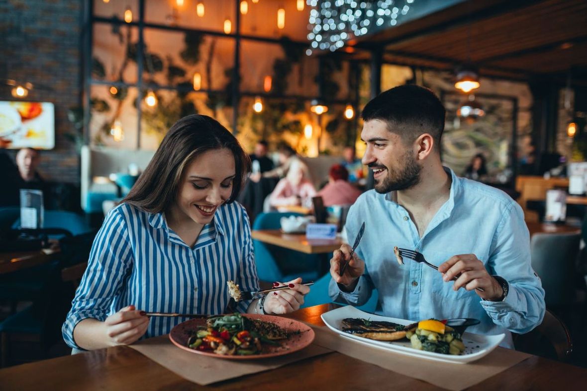 couple smiling at dinner