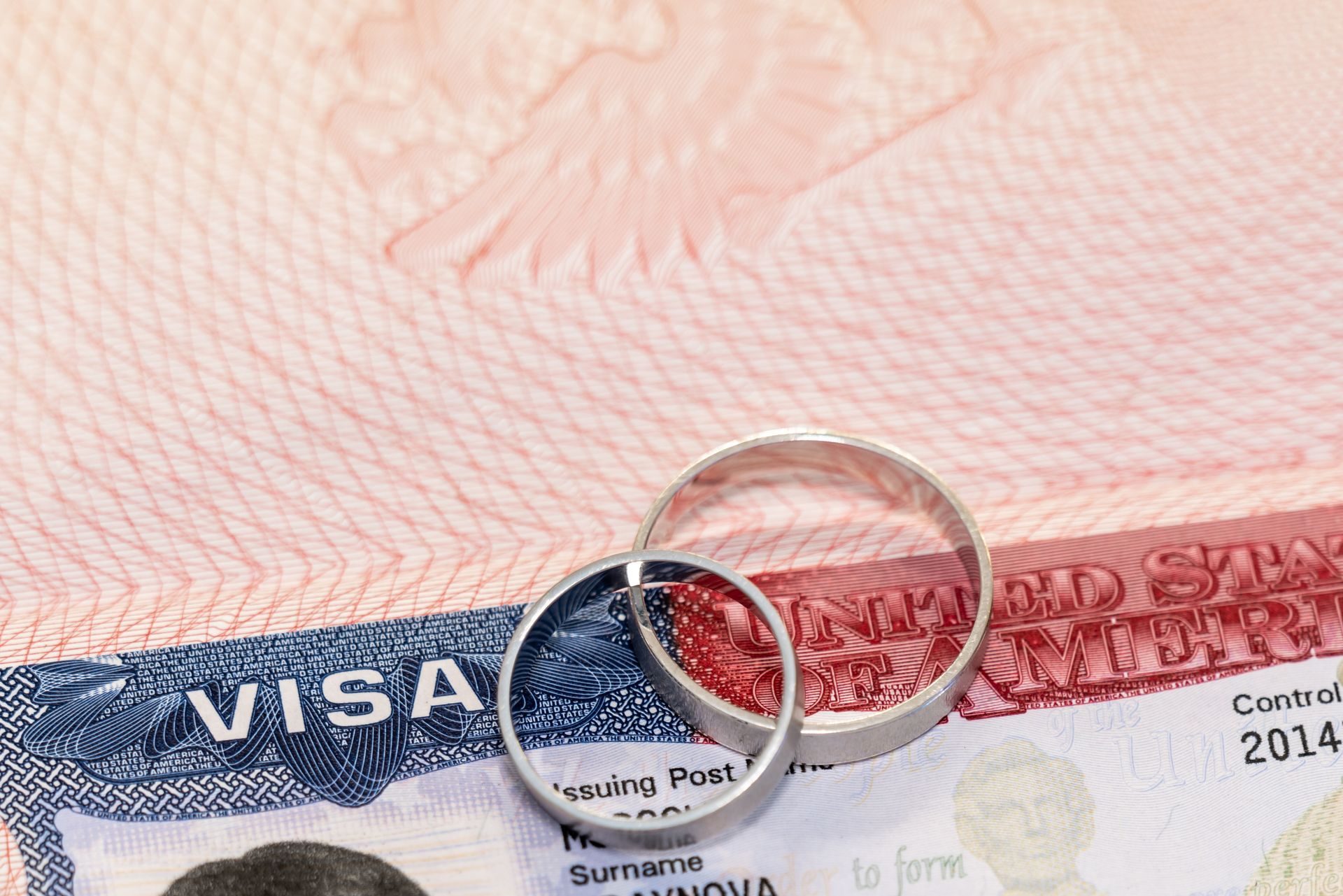 Wedding rings on a US visa document.