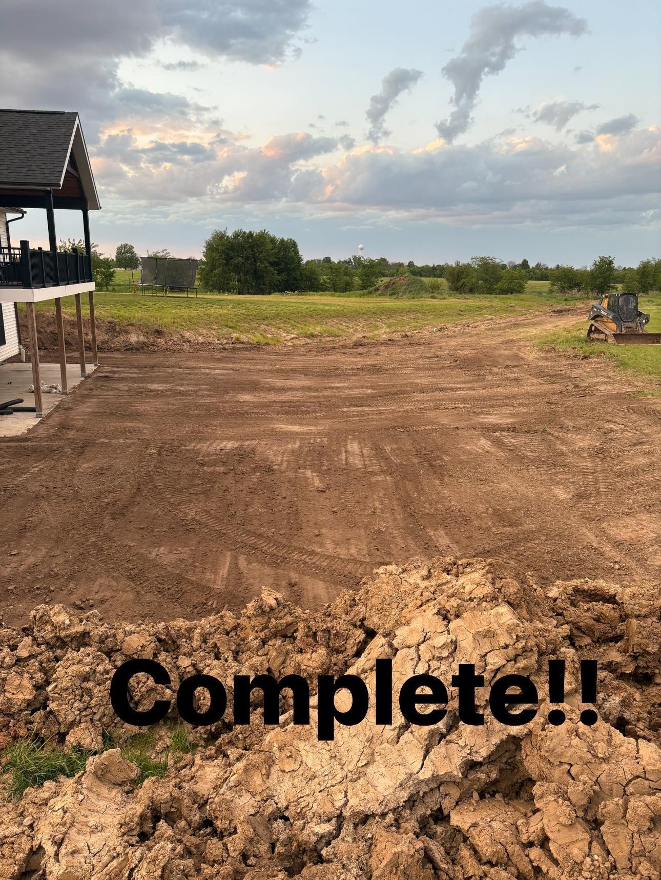 Dirt clearing finished on a rural lot under a cloudy sky, with “Complete!!” text at the bottom.