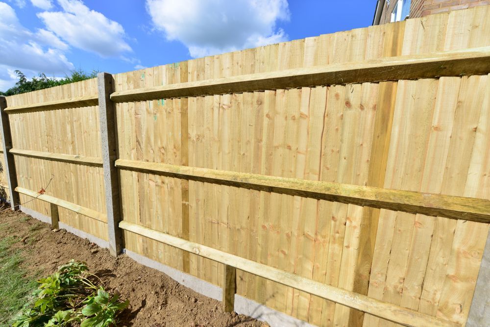 A Close Up Of A Wooden Fence With A Blue Sky In The Background — Arecta Fence In Lakewood, NSW