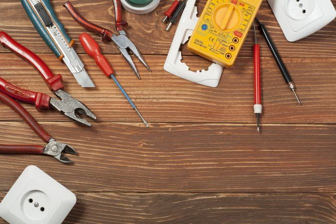 A Bunch of Tools Are on a Wooden Table — Patrick Lunney Home Appliance Service & Repairs in Maudsland, QLD