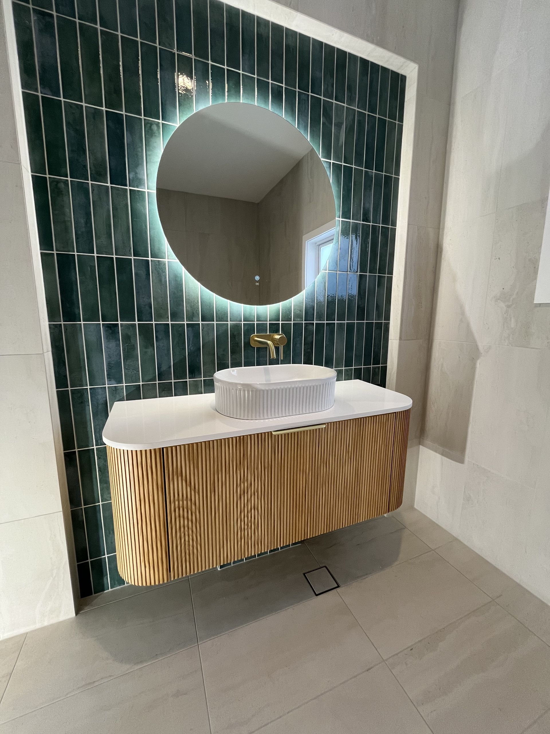 Modern Bathroom Vanity with Round Backlit Mirror — Midcoast Wall & Floor Tiling in Sapphire Beach, NSW