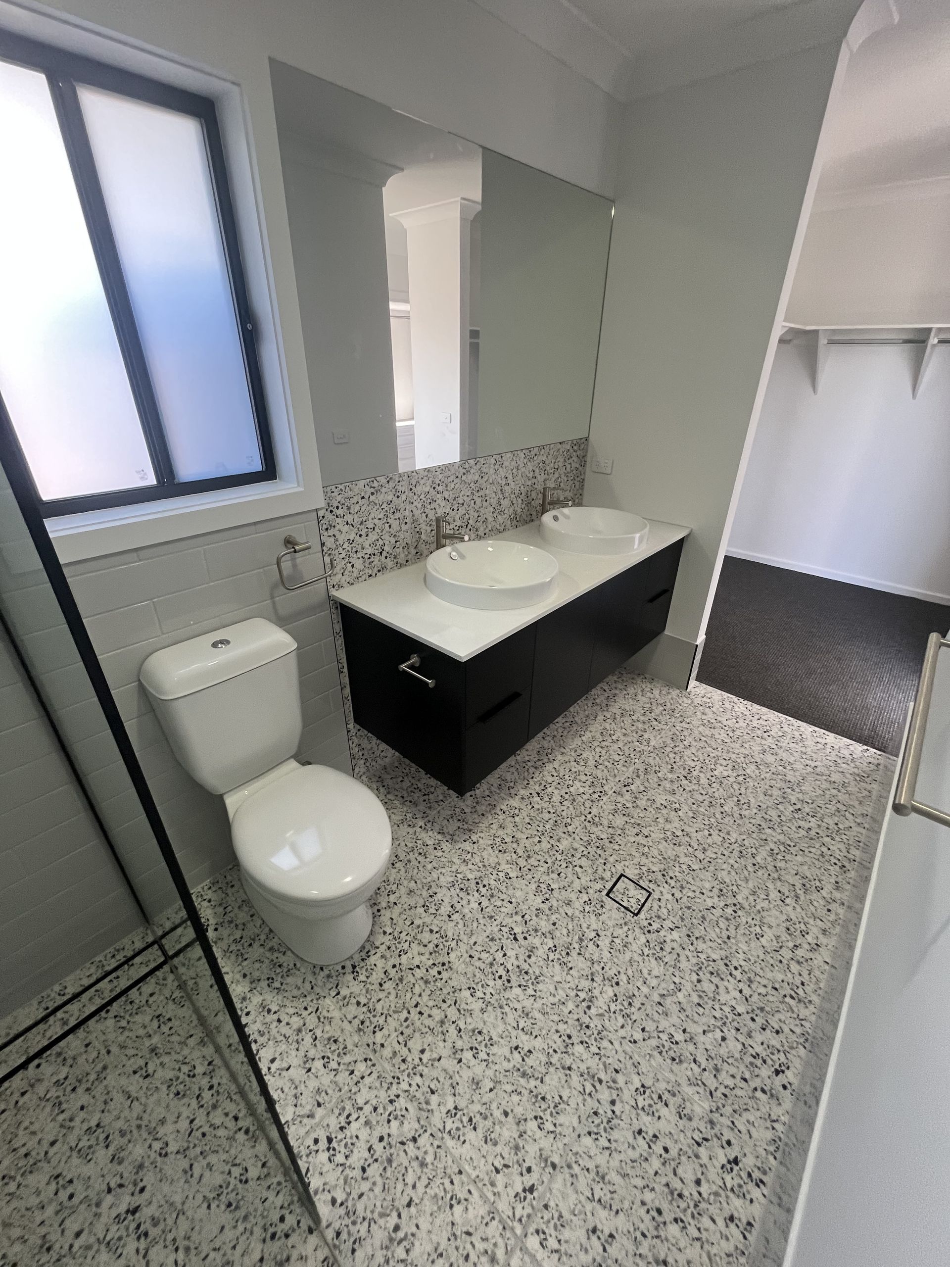 Modern Bathroom with Toilet, Double Sink Vanity — Midcoast Wall & Floor Tiling in Toormina, NSW