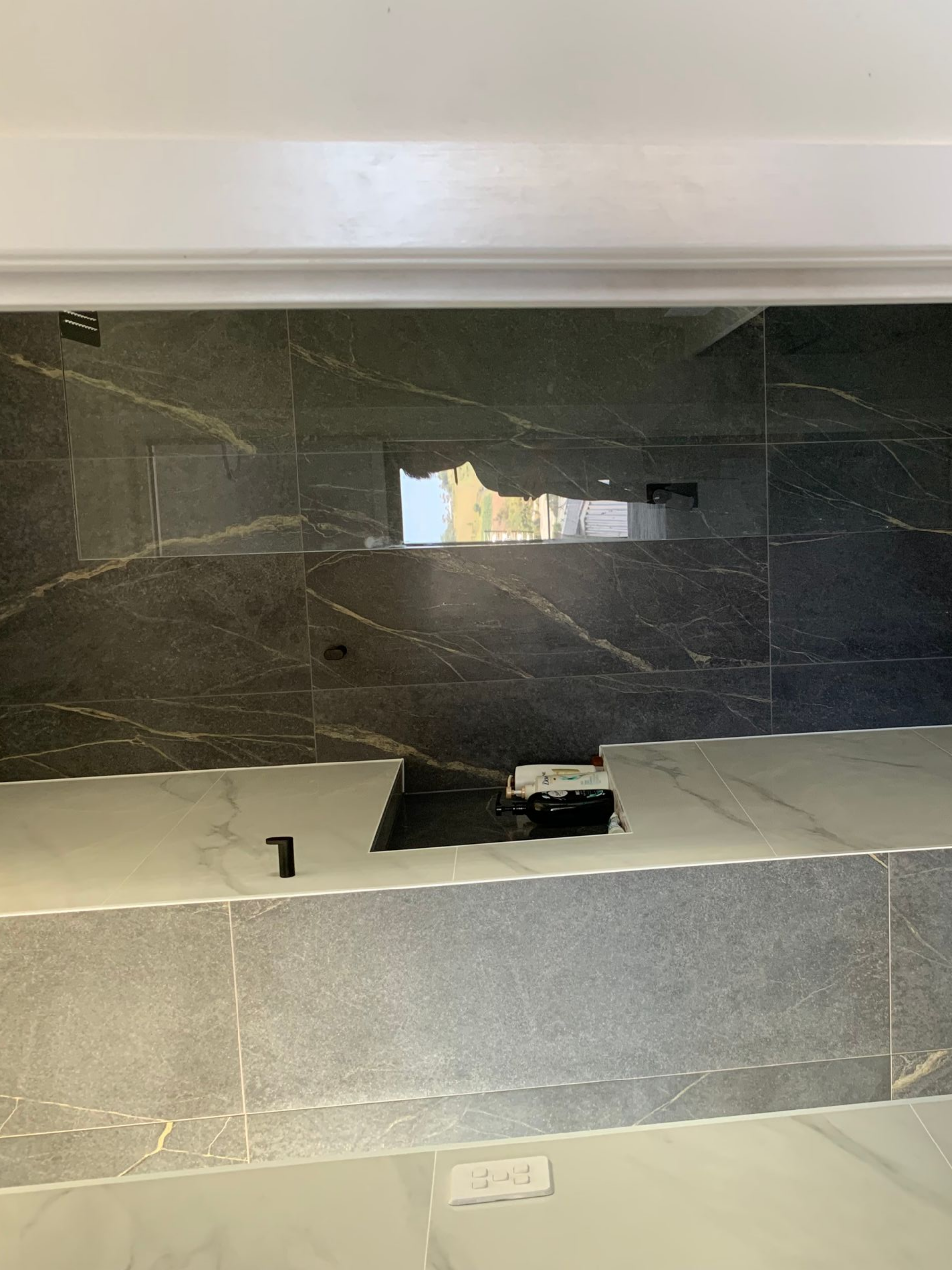 Grey Tiled Wall with A Built-In Recessed Shelf — Midcoast Wall & Floor Tiling in Woolgoolga, NSW