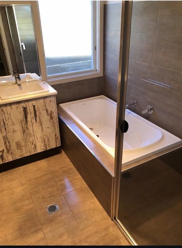 Modern Bathroom with Freestanding Tub — Midcoast Wall & Floor Tiling in Boambee East, NSW