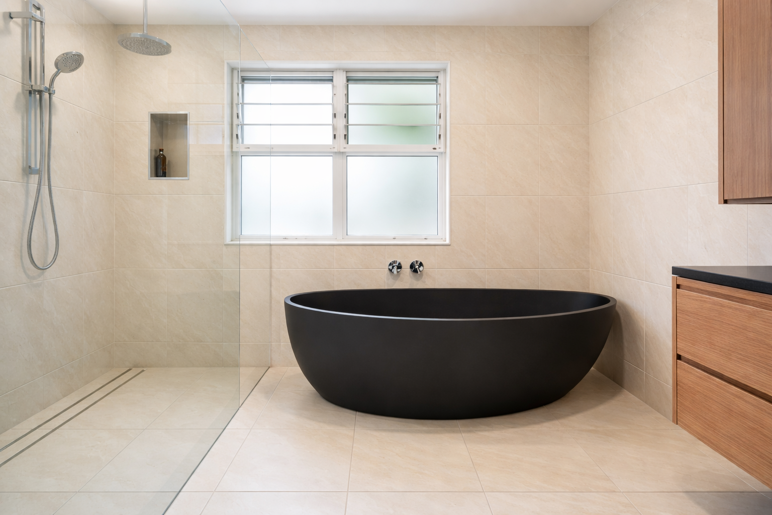 Modern Bathroom with A Black Freestanding Tub — Midcoast Wall & Floor Tiling in Toormina, NSW