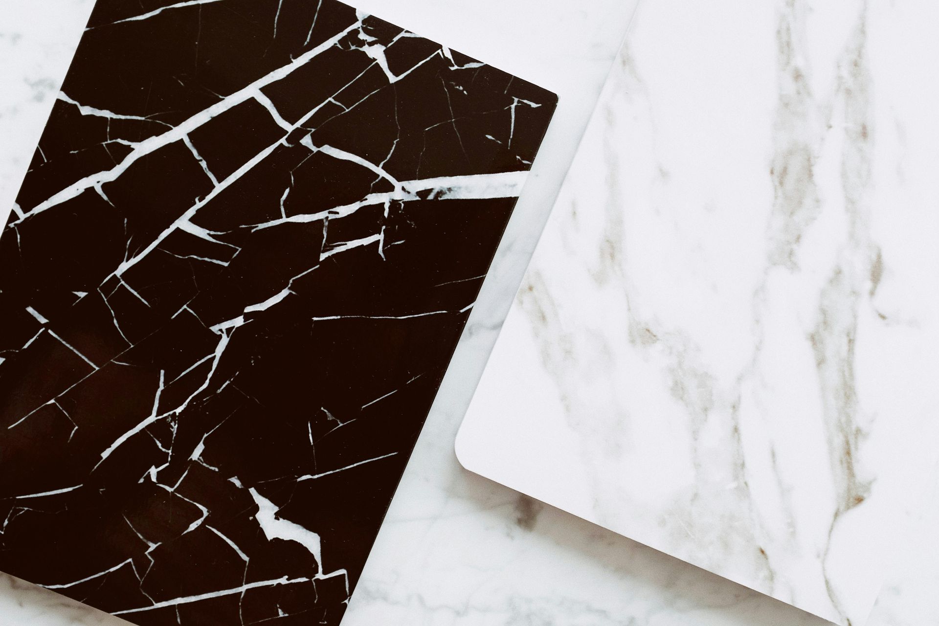 Two Marble Tile Samples: One Dark Brown — Midcoast Wall & Floor Tiling in Toormina, NSW