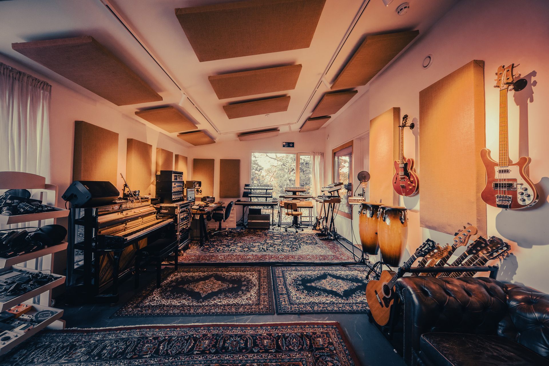 a large room with a lot of musical instruments on the wall .