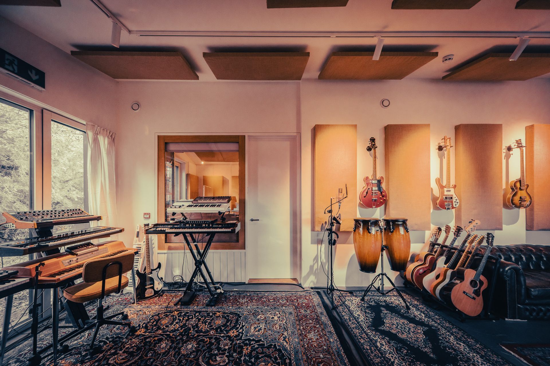 a room with a lot of musical instruments in it .