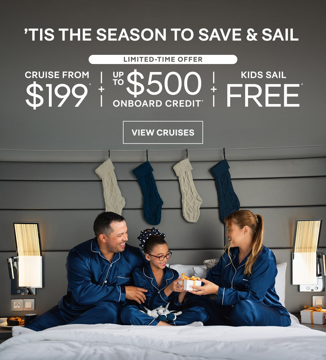 Holiday cruise ad with smiling family in matching blue pajamas on a bed, showing “Cruise from $199” and “Kids sail free”