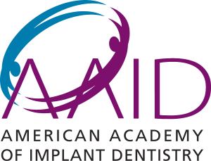 The logo for the american academy of implant dentistry
