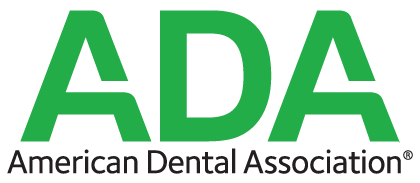 The logo for the american dental association is green and white.