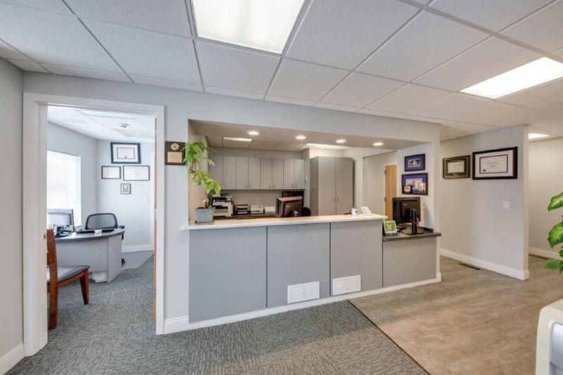 There is a reception desk in the middle of the room.