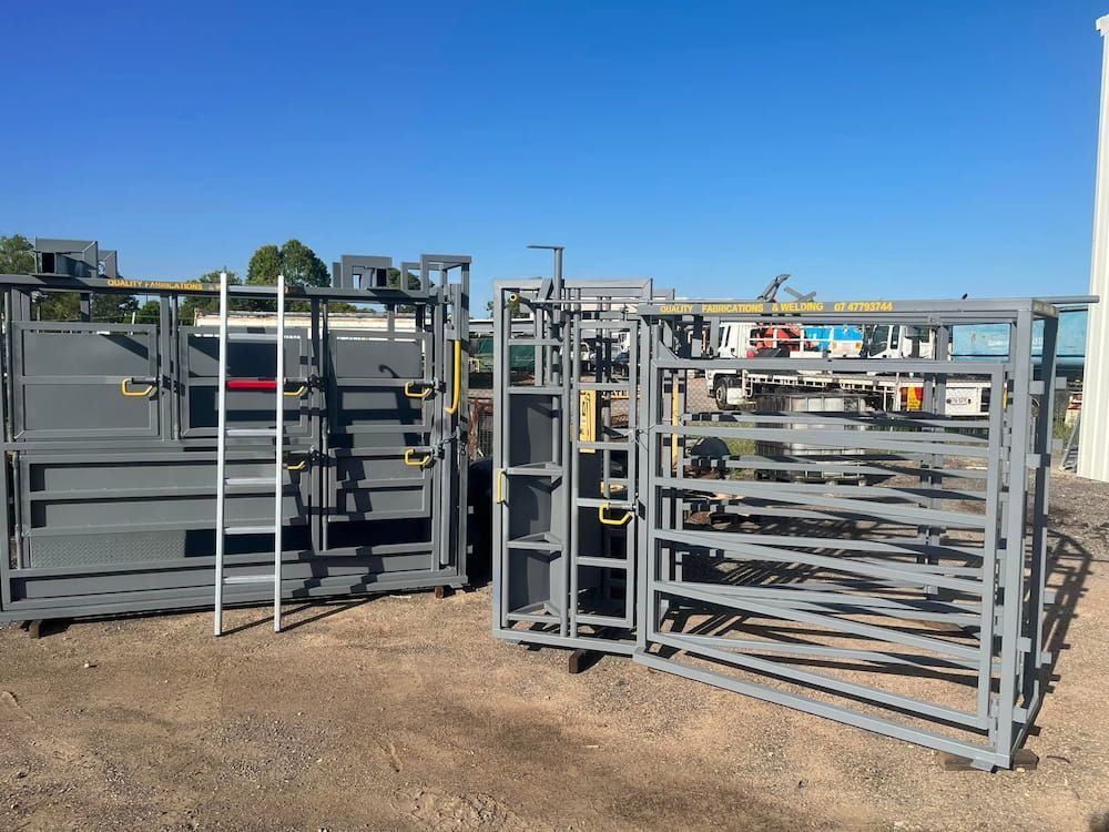 A Bunch Of Metal Fences Sitting On Top Of A Dirt Field — Quality Fabrications & Welding Pty Ltd In Bohle, QLD