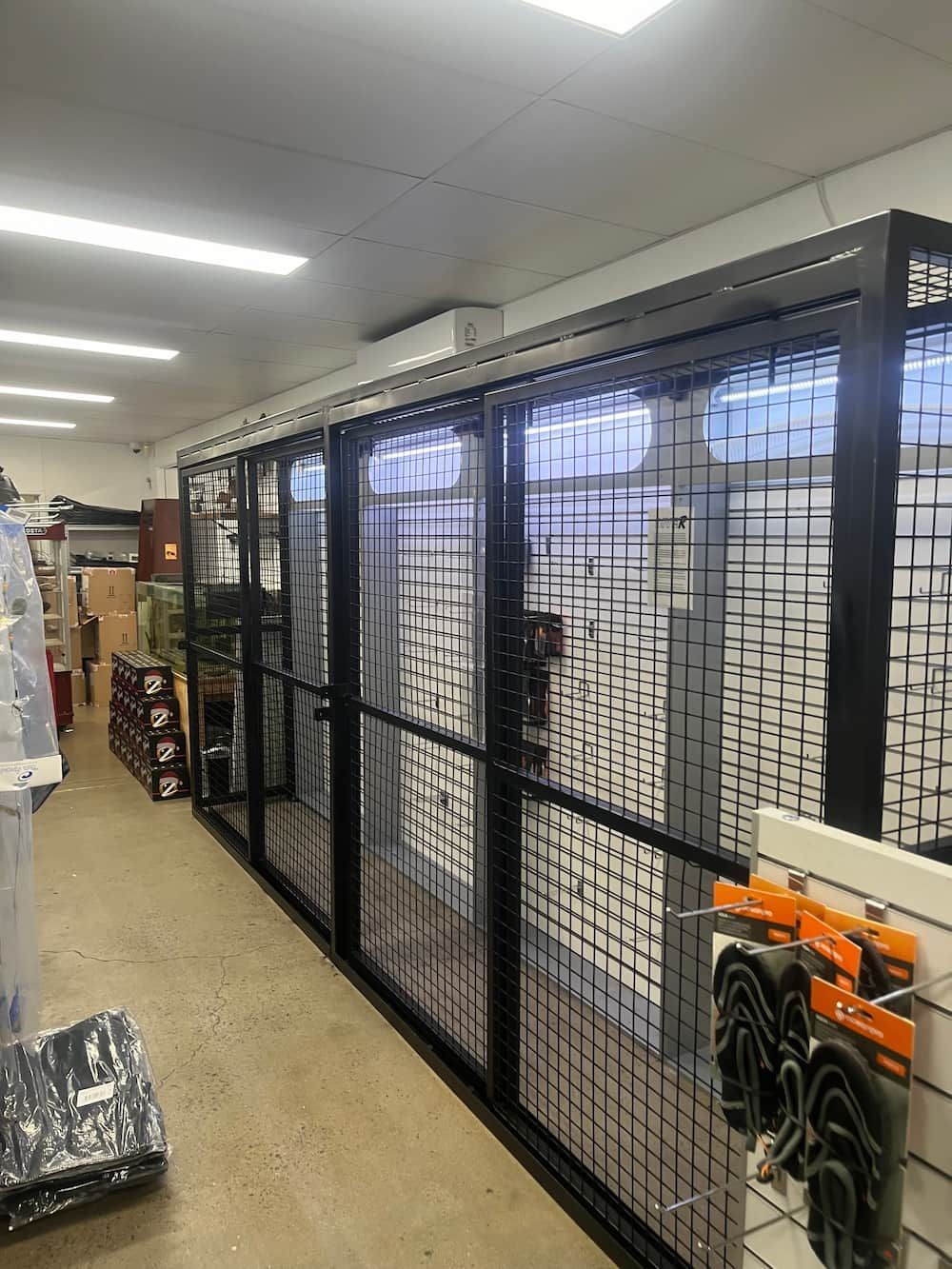 A Row Of Cage Dividers In A Store — Quality Fabrications & Welding Pty Ltd In Bohle, QLD