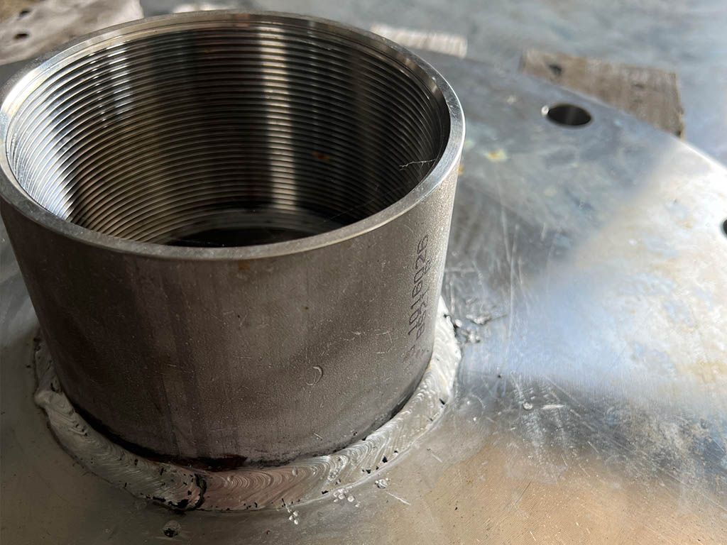 A Close Up Of A Metal Cylinder On A Metal Surface — Quality Fabrications & Welding Pty Ltd In Bohle, QLD