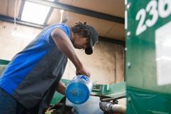 A mechanic pouring oil | Joey's Truck & Auto Repair