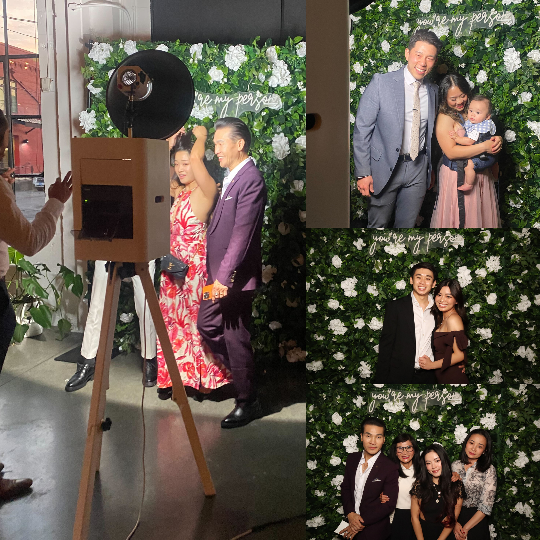 Guests posing at a floral backdrop event, with a tripod camera in the foreground and several portrait prints on the right.