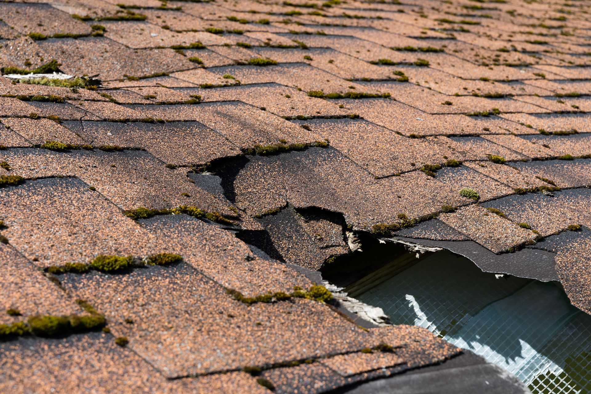 A close up of a roof with a hole in it.