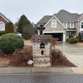 A house with a mailbox in front of it