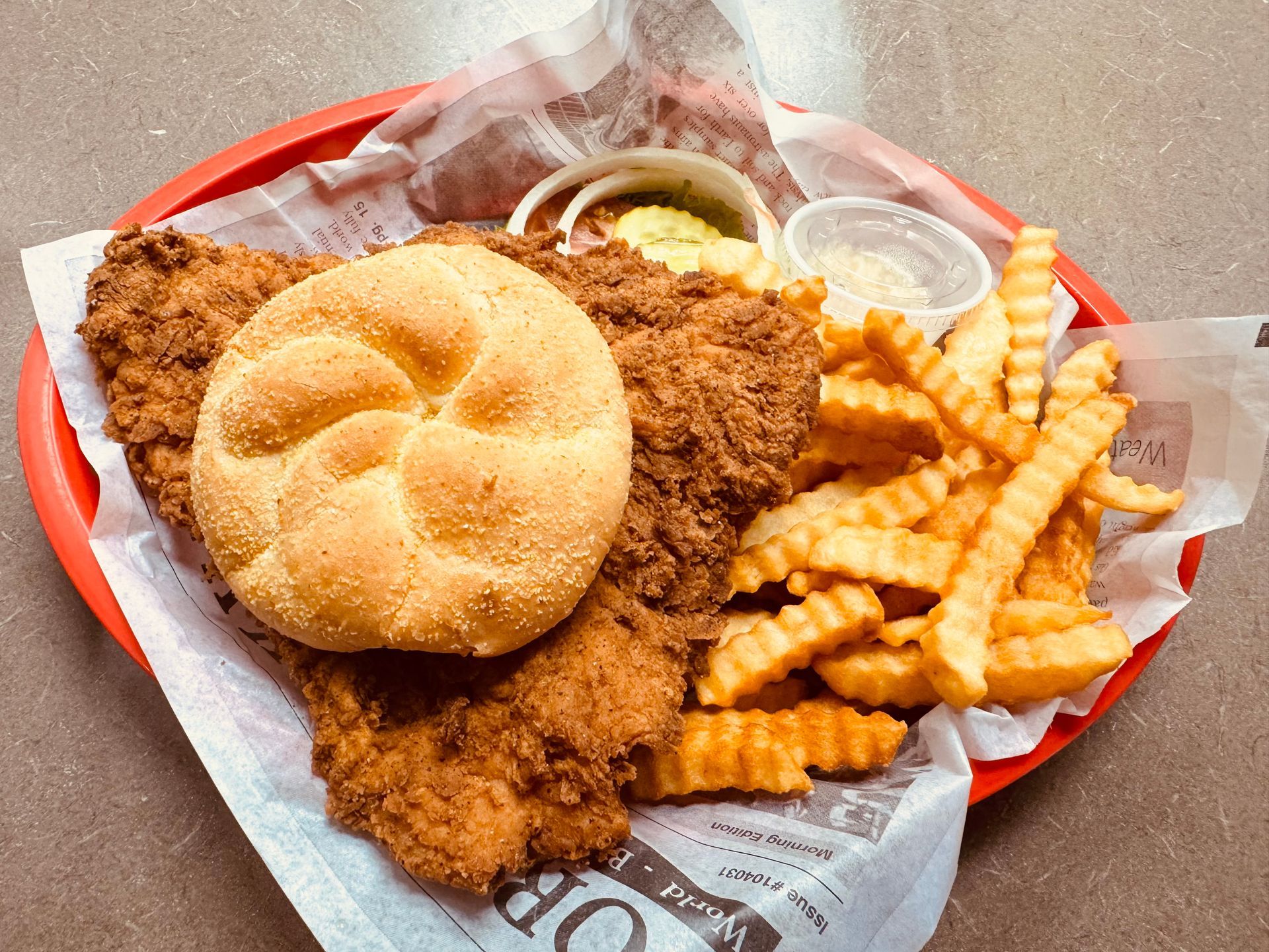 half tenderloin special. Hand cut, pounded and breaded pork tenderloin with crinkle-cut fries.