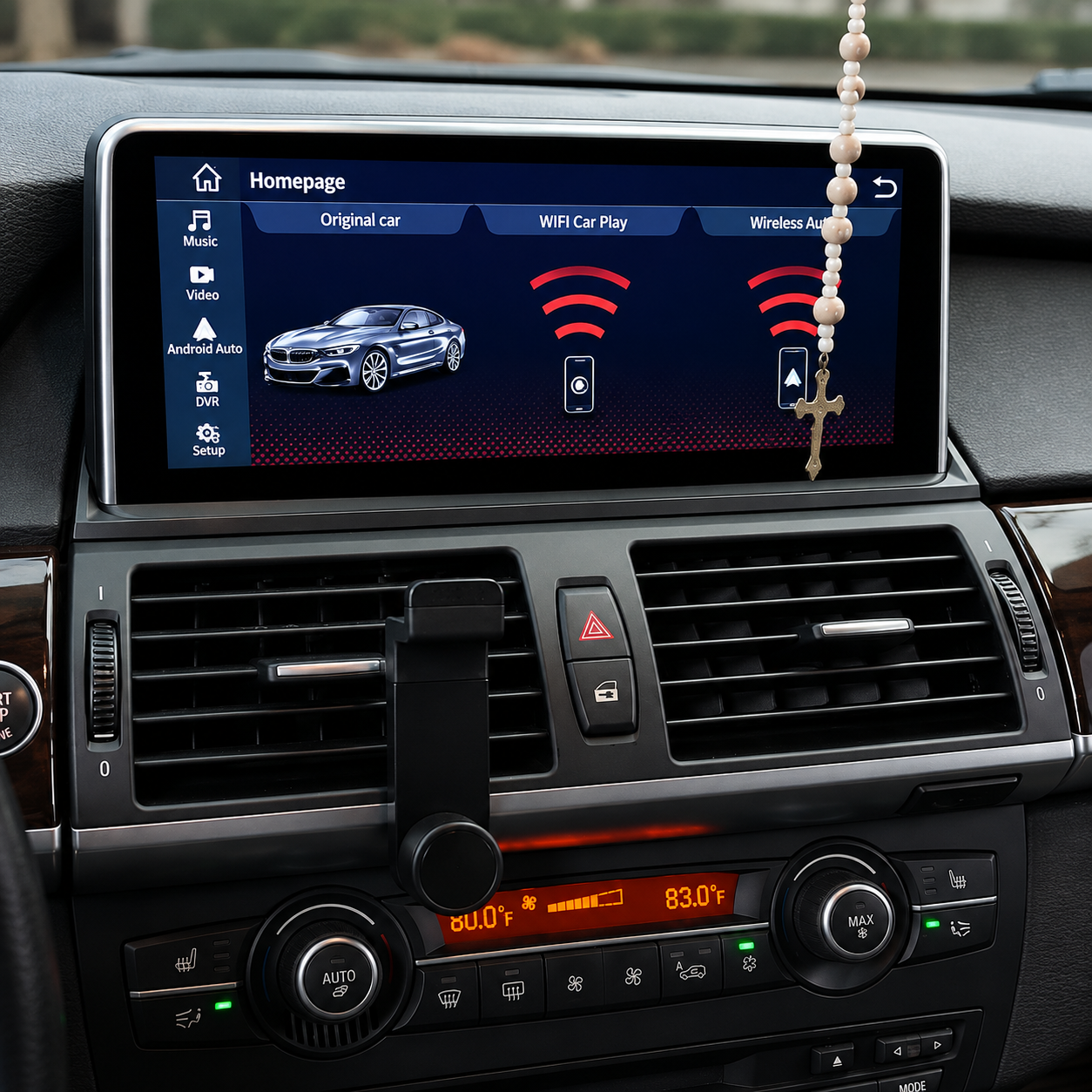 Car dashboard with infotainment screen showing a car graphic and wireless signal icons, air vents, and radio controls