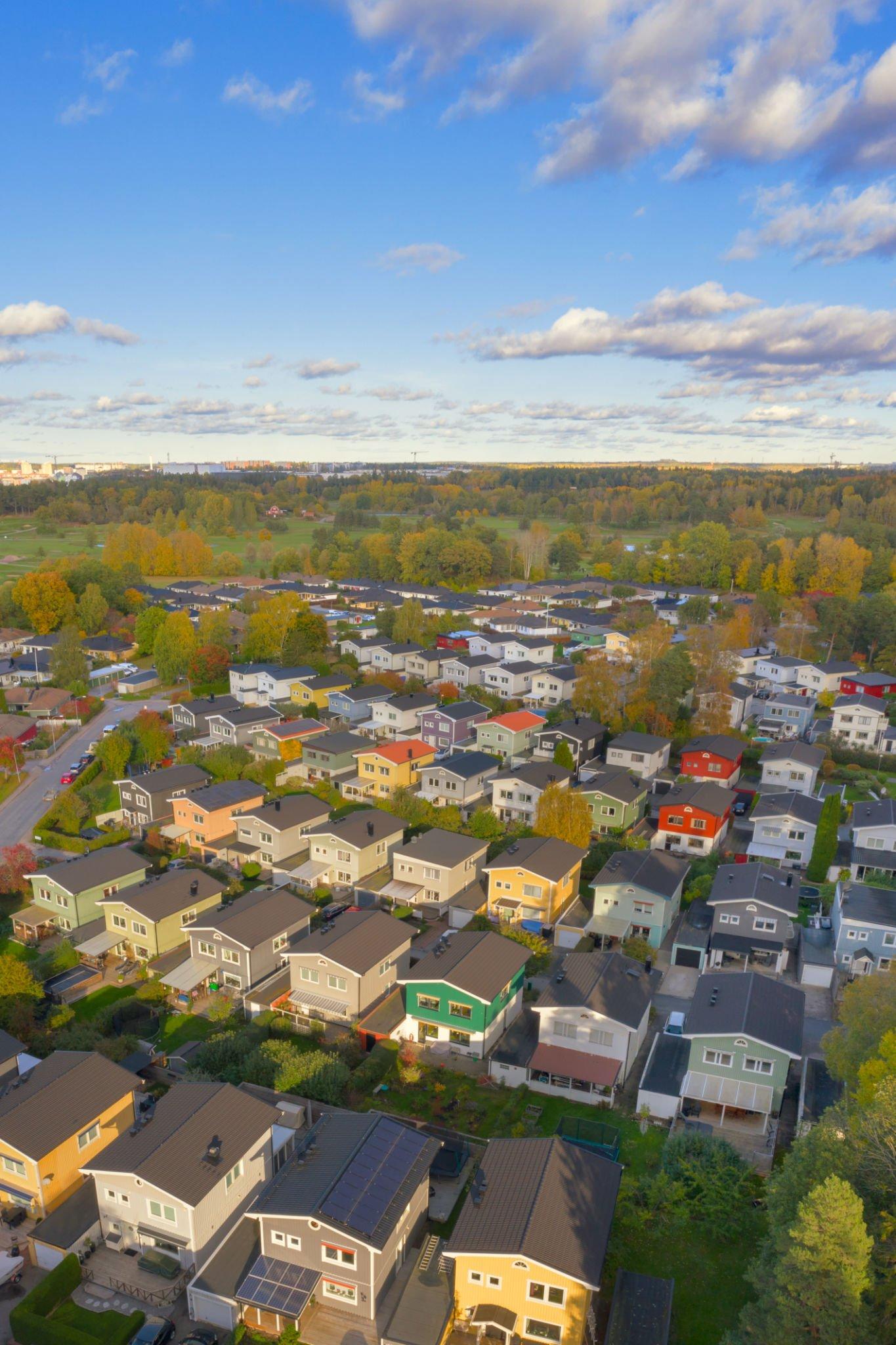 An aerial view of a residential area with lots of houses and trees.