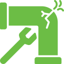 Commercial Building Green plumbing pipe with a crack and a wrench.