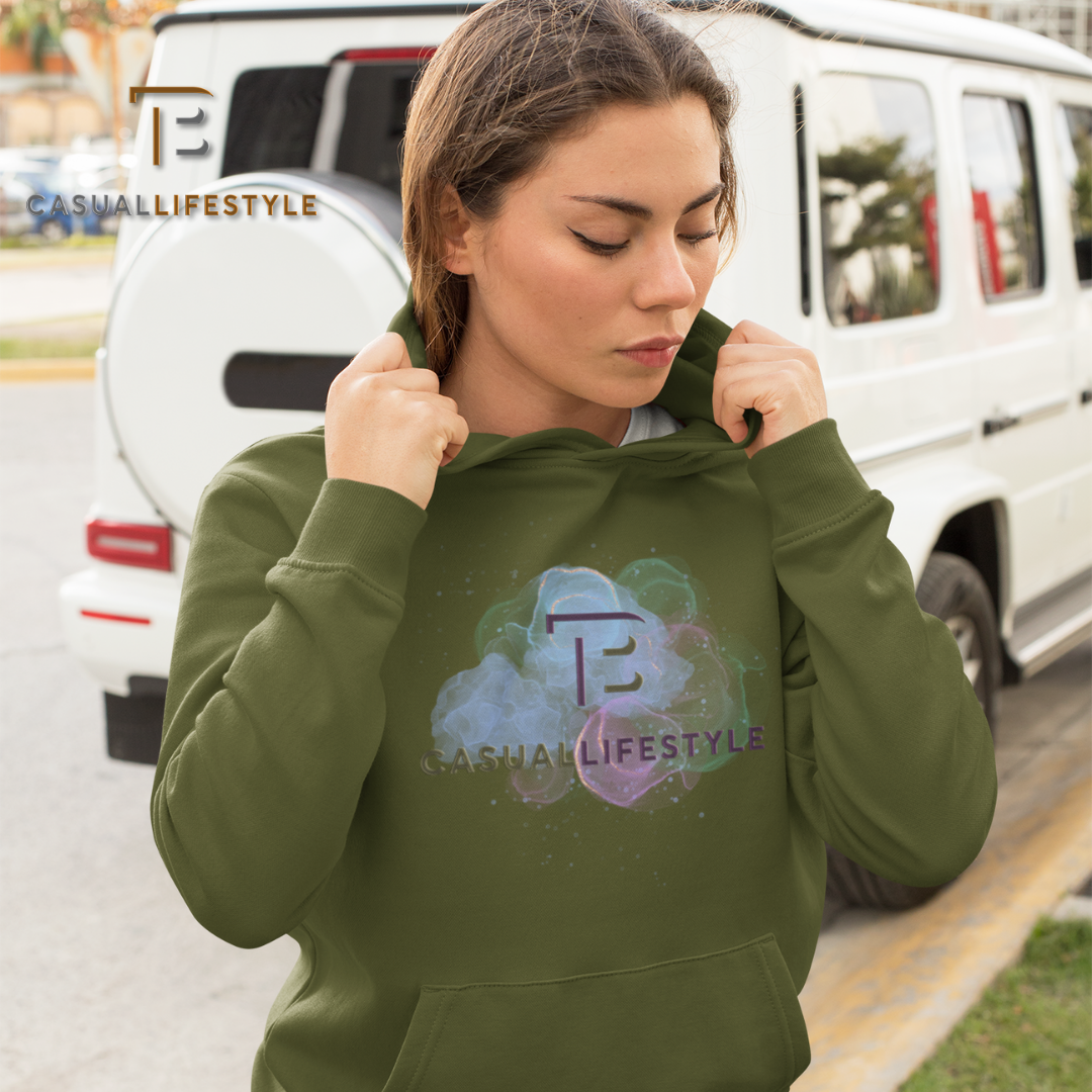 A woman wearing a green hoodie is standing in front of a white suv