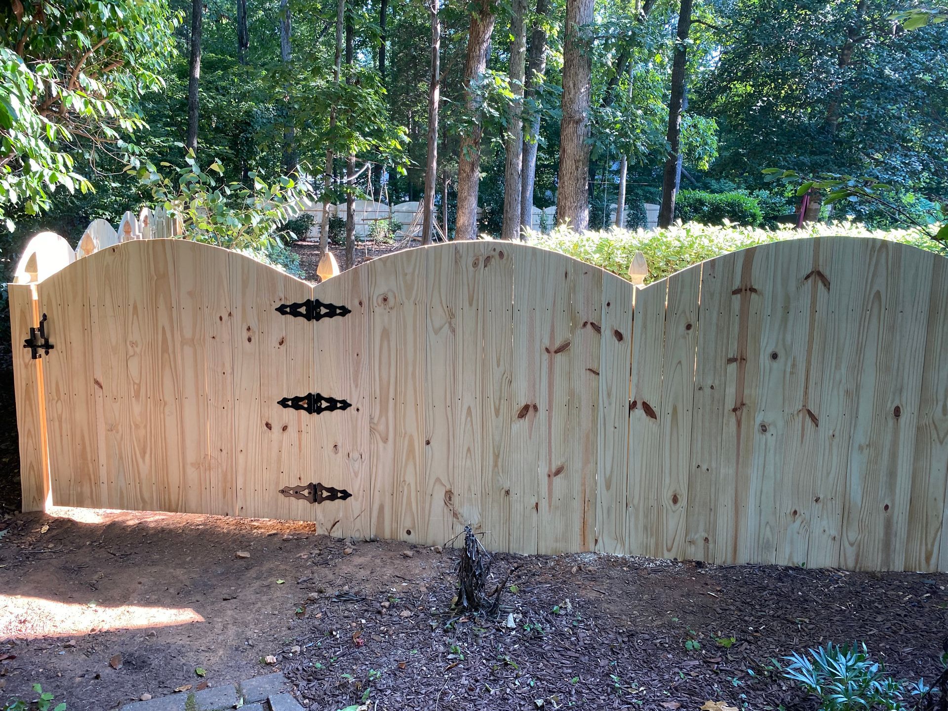 A wooden fence with a gate and the number 4 on it