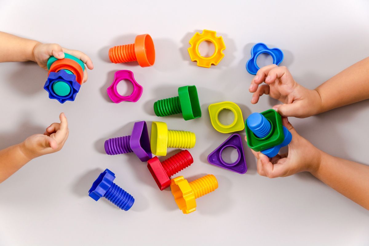 Two Children Playing with Toys — Las Cruces, NM — Discovery Child Development Center Two Children Playing with Toys — Las Cruces, NM — Discovery Child Development Center